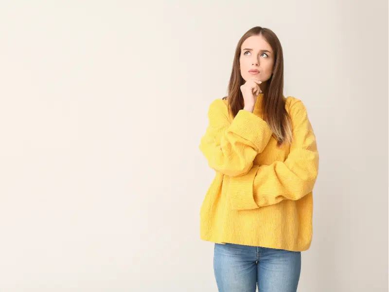 Picture of a thoughtful woman in a blog post titled "How to Avoid Emotional Eating"