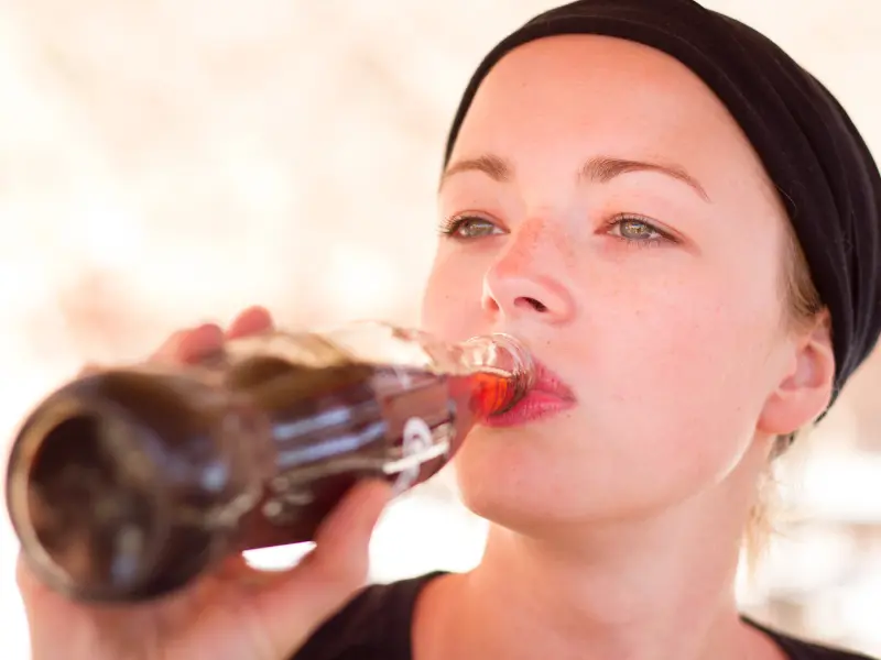 woman drinking soda